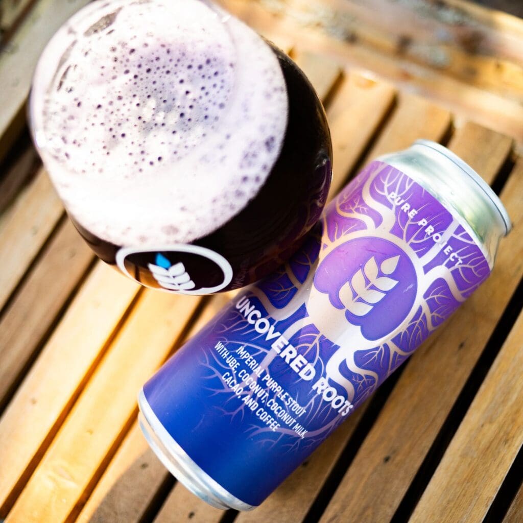 Image of can of Uncovered Roots next to a pour