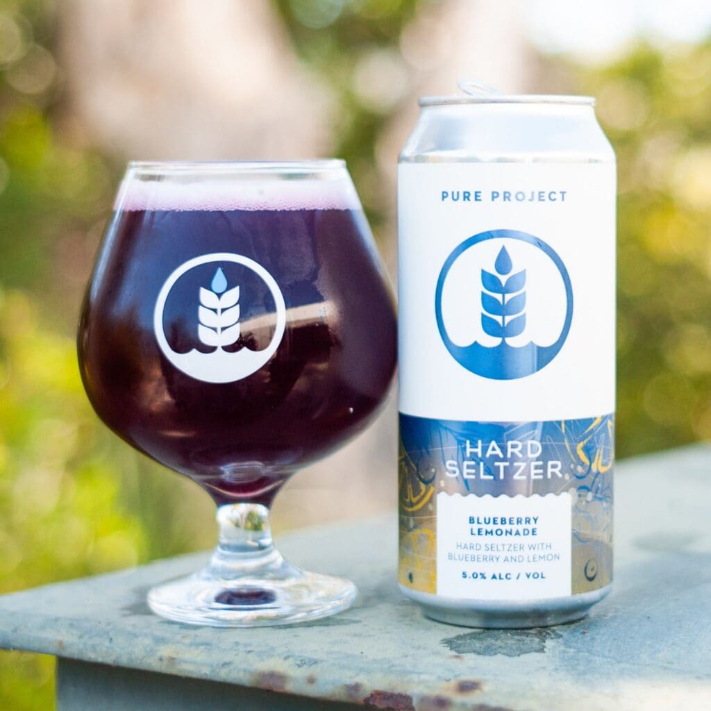 Can and pour of Blueberry Lemonade Hard Seltzer