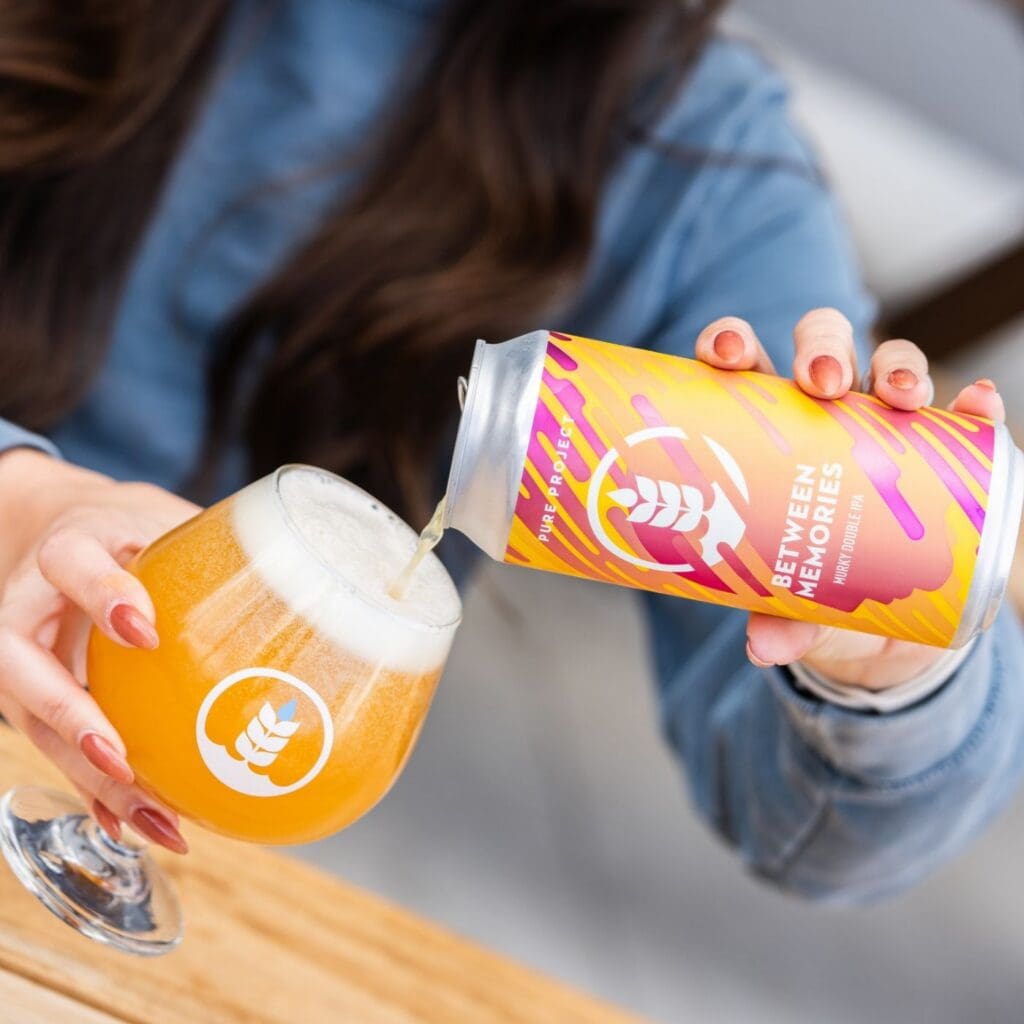 Can and pour of Between Memories Murky Double IPA